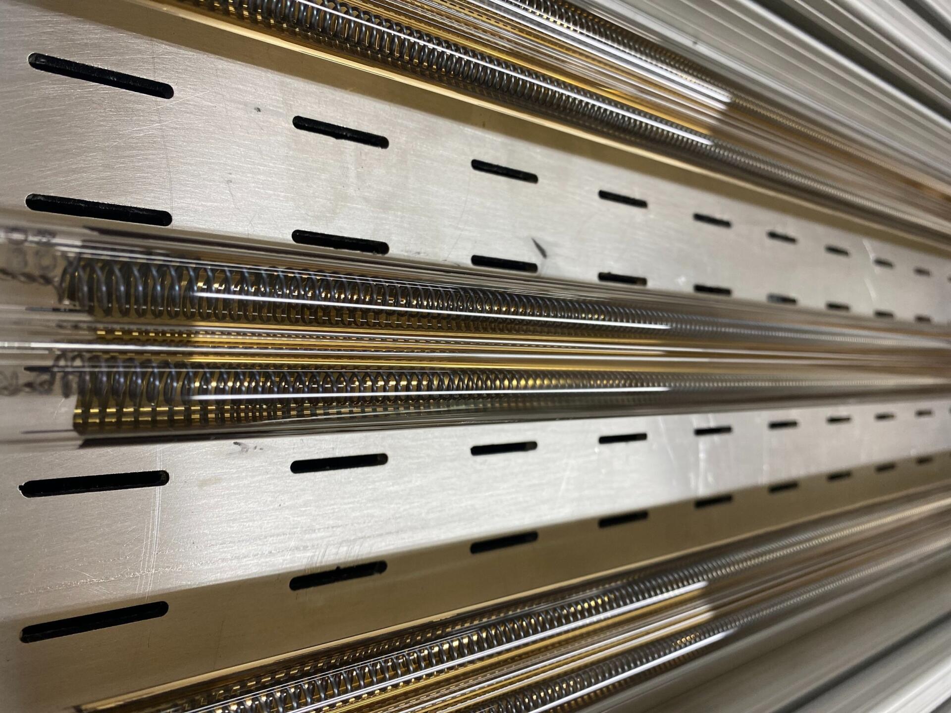 Wall of twin-tube quartz infrared replacement lamps at Fannon Products