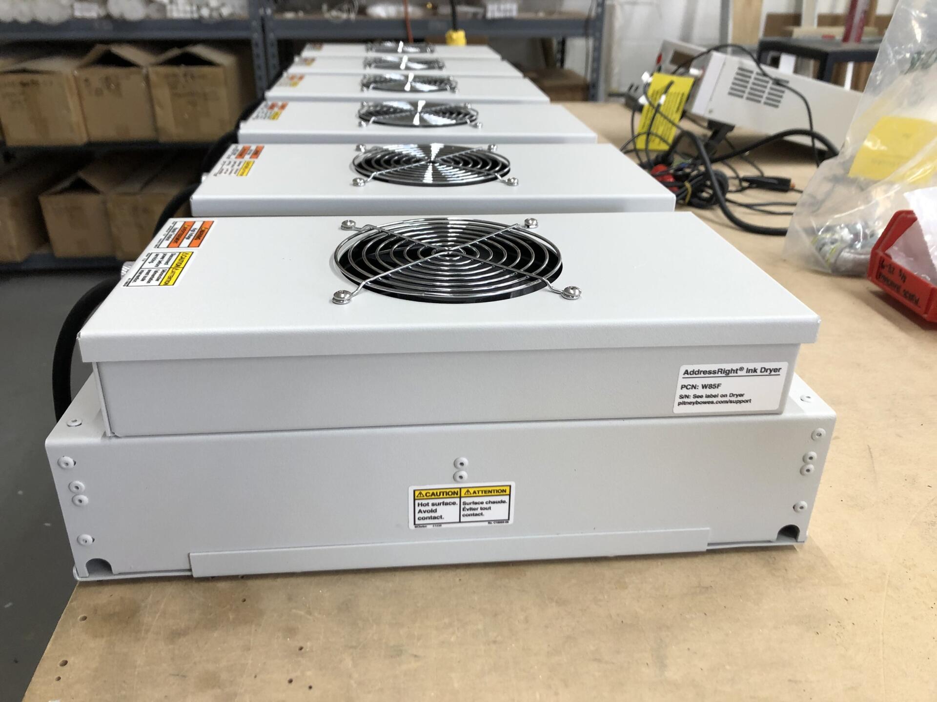 Fannon LightSpeed inkjet drying systems lined up on a work table